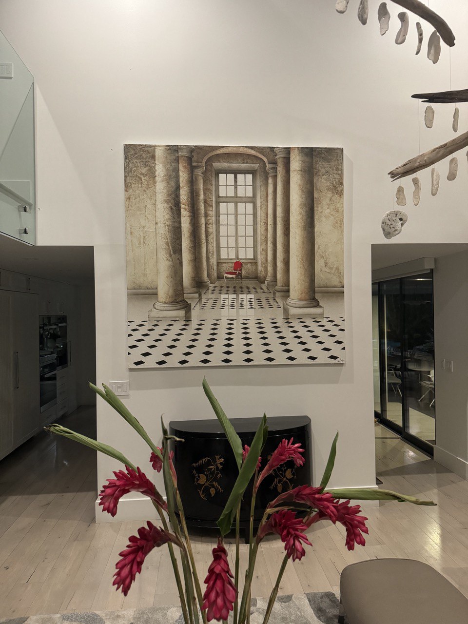 Large oversized canvas artwork installed on high interior wall in modern luxury home in Triangle NC