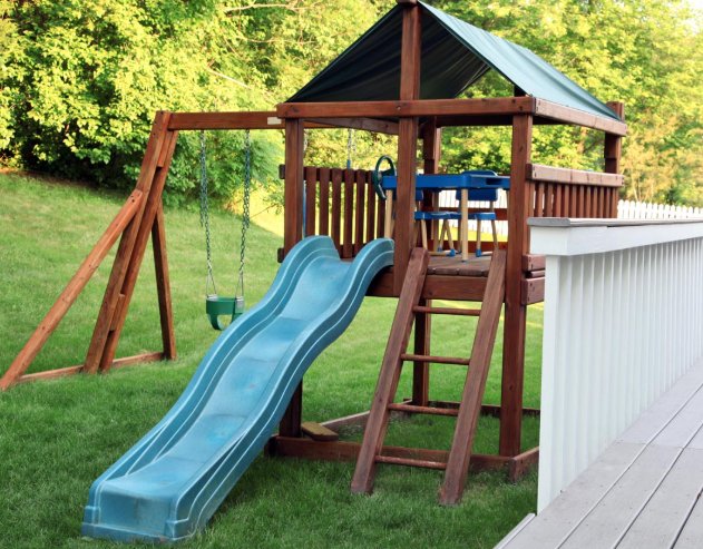 Backyard playset with slide and swing fully assembled by Holly Springs Handyman in Triangle NC