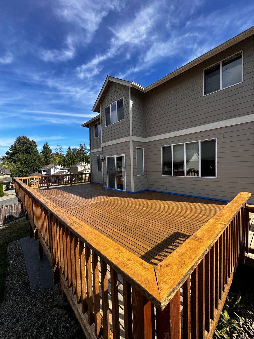 Large elevated deck freshly stained and railing refinished in Triangle NC