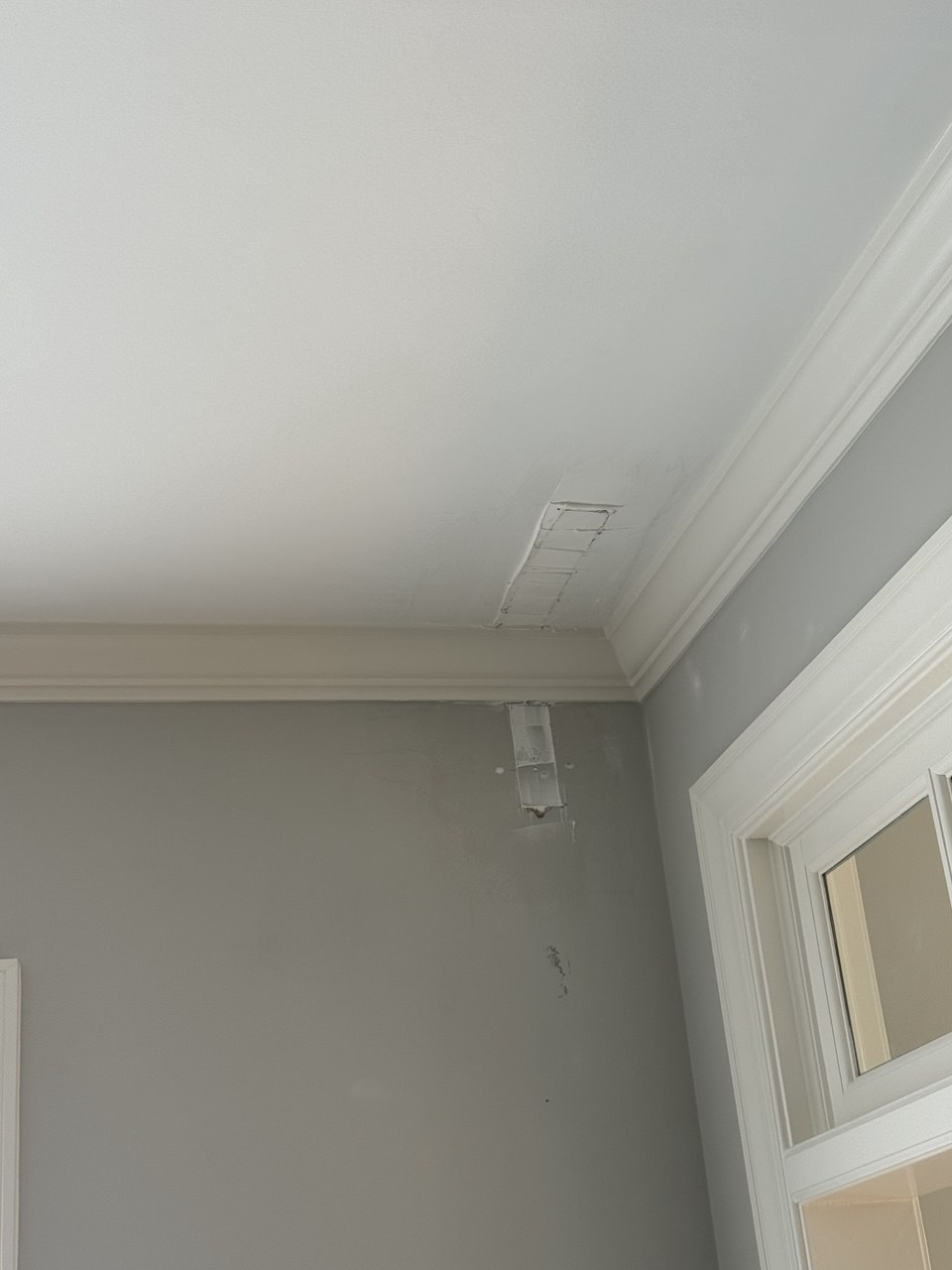Drywall damage before repair — ceiling crack and hole in Triangle NC home