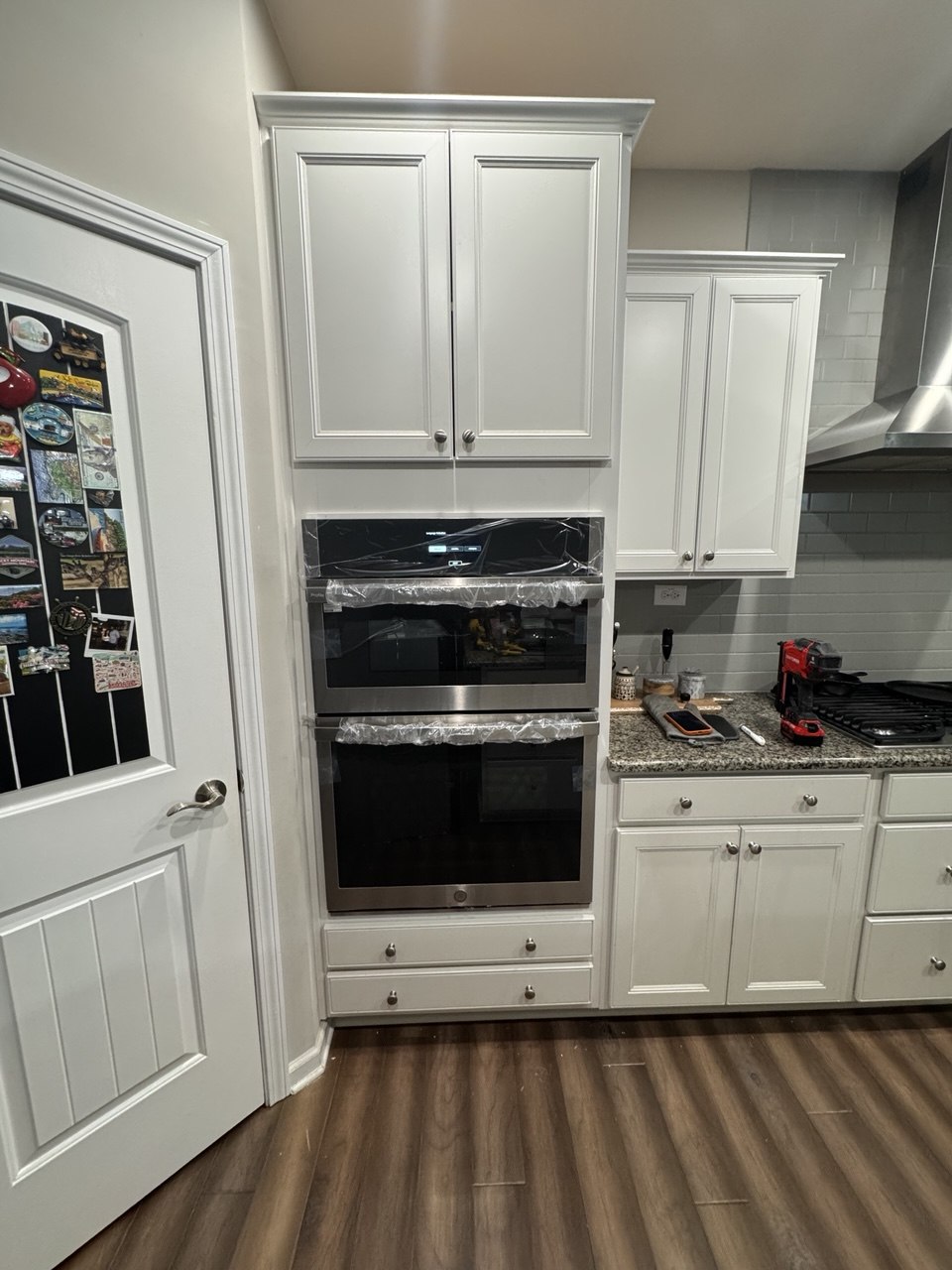 New built-in wall oven and microwave combo unit installed in kitchen cabinet in Triangle NC home