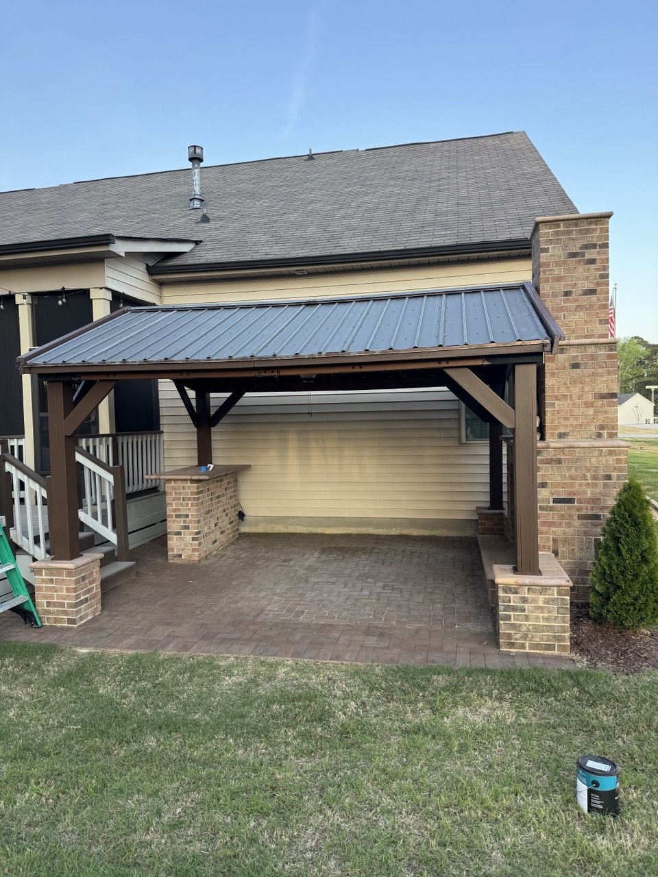 Pergola sanded and repainted in dark brown color at Triangle NC home exterior