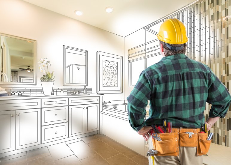 Contractor reviewing bathroom remodel design plan in Triangle NC home