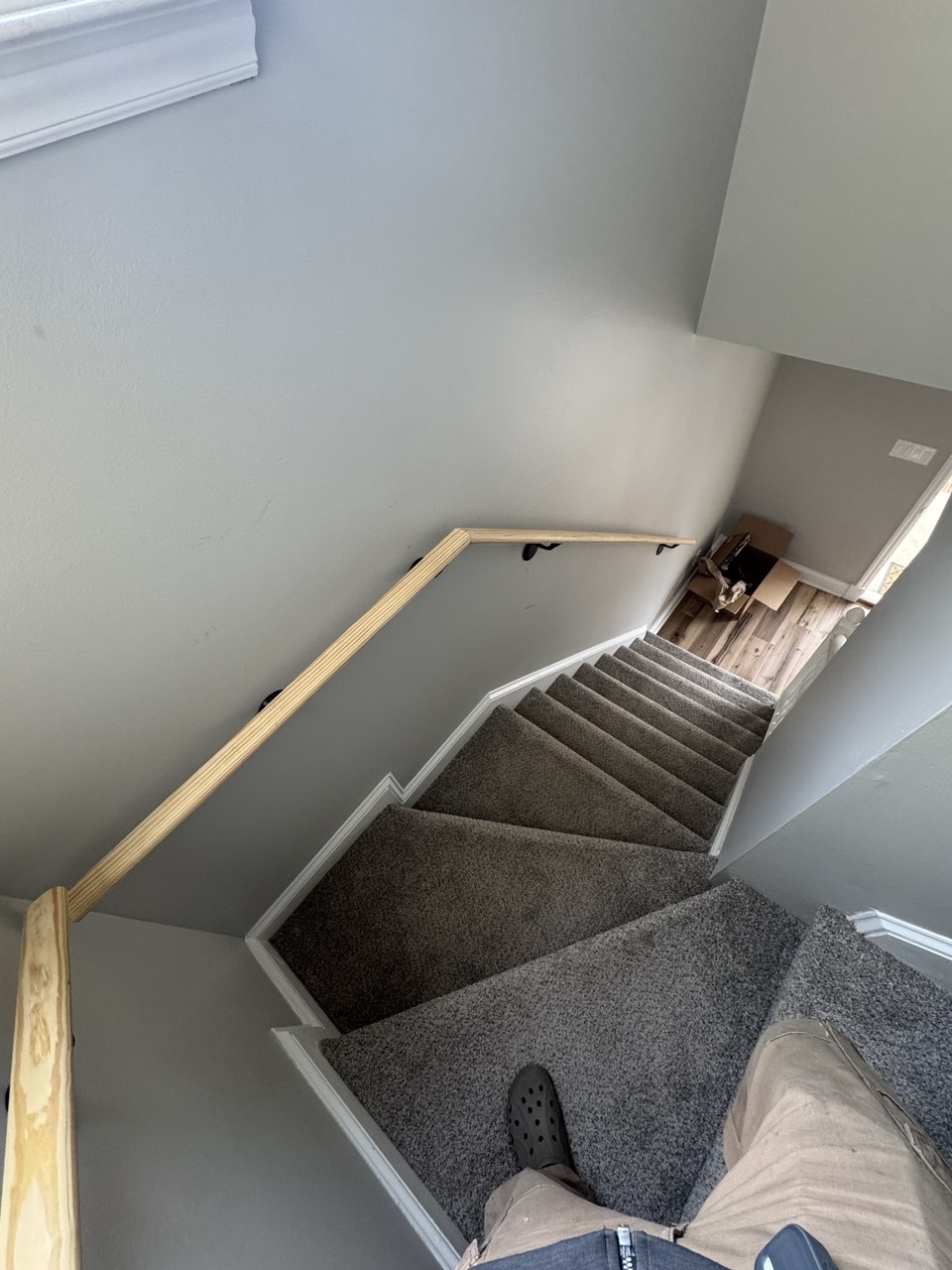 Interior stair handrail installation on carpeted stairs in Triangle NC home